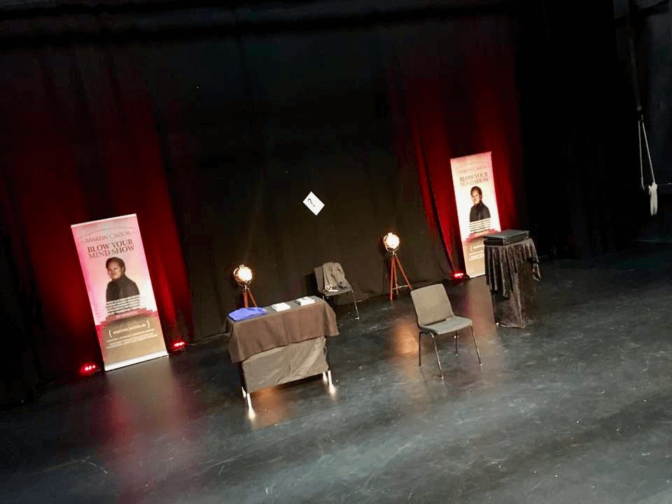 Martin Castor on stage with hypnosis volunteers during a live show